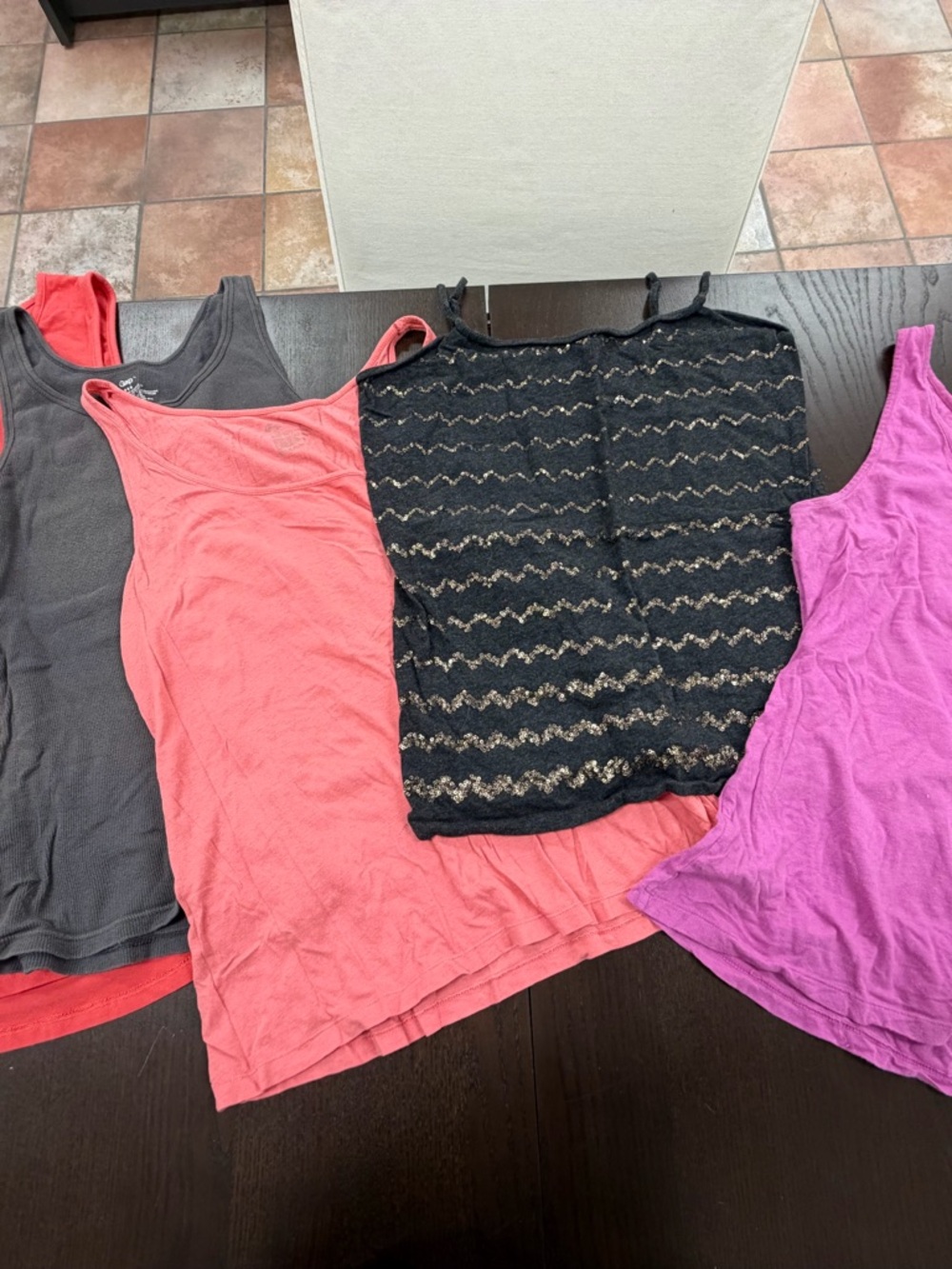 Five size large tank tops

One does not have the tags to show the size